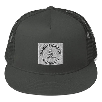 A charcoal grey snapback hat with a flat visor, featuring an embroidered logo on the front, mesh back panel, and a plastic snap closure.
