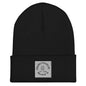 Black beanie with an embroidered white peace logo on the front.