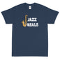 A navy blue t-shirt with 'Jazz Heals' text and a graphic of a saxophone on the front, and a distressed white logo on the back.