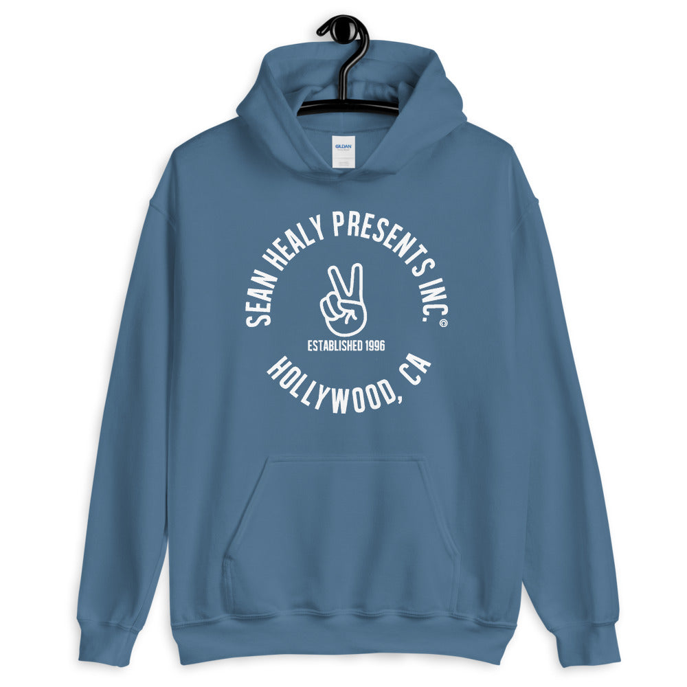 A blue hoodie with the white text 'SHAUN HILL PRESENTS, INC. HOLLYWOOD, CA' and a peace sign symbol on the front.