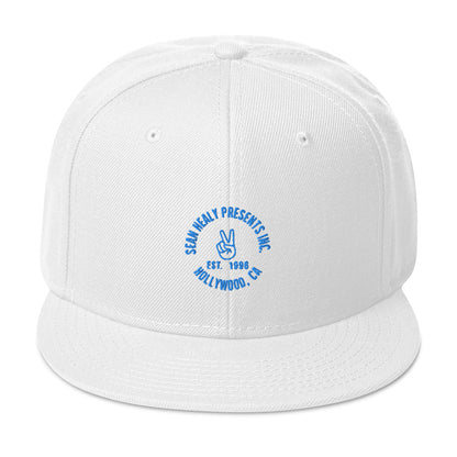 White snapback hat with an embroidered logo on the front panel.
