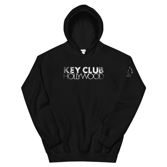 Black unisex hoodie with the text 'KEY CLUB HOLLYWOOD' in distressed white letters on the front and a distressed SHP peace logo on the left sleeve.